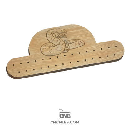 An image of a CNC file showing a Tie Rack Snake design with detailed cutout patterns for woodworking.